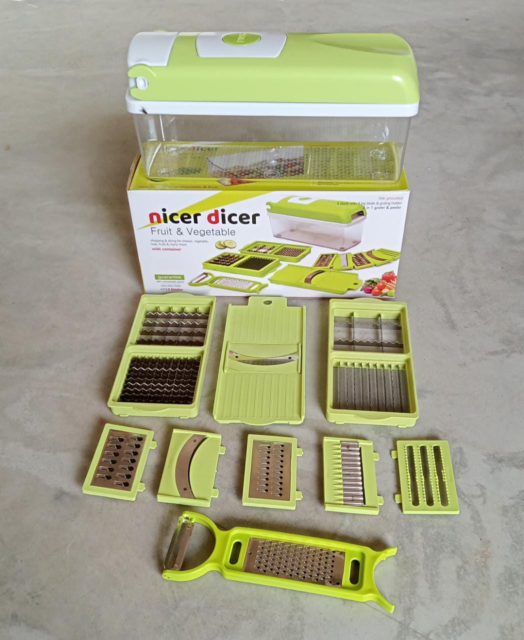 Plastic 13-in-1 grater and slicer with various tools for kitchen use Plastic 13-in-1 grater and slicer with various tools for kitchen use
